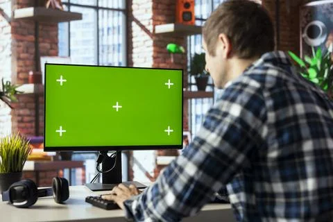 Man typing on green screen computer keyboard Stock Photos