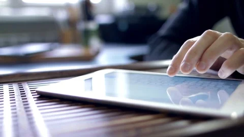 Man typing on his ipad for work Stock Footage 79836919