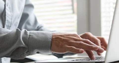 Man typing at his laptop computer Stock Footage 116749104