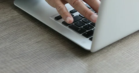 Man typing at his laptop computer Stock Footage 116750181
