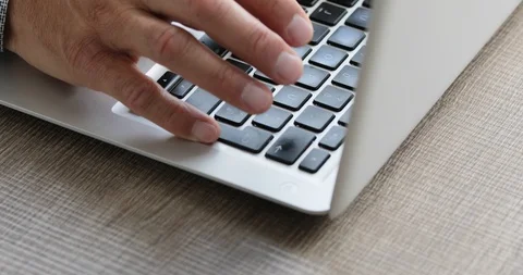 Man typing at his laptop computer Stock Footage 116750786