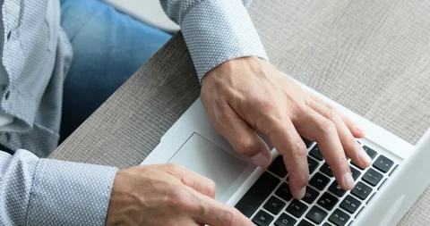 Man typing at his laptop computer Video stock 116751580