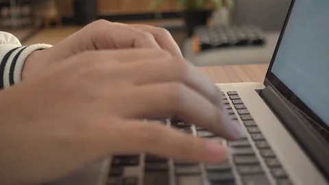 A man is typing on his laptop. Stock Footage 104888339