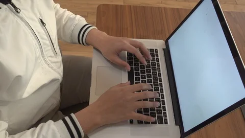 A man is typing on his laptop. Stock Footage 104888347