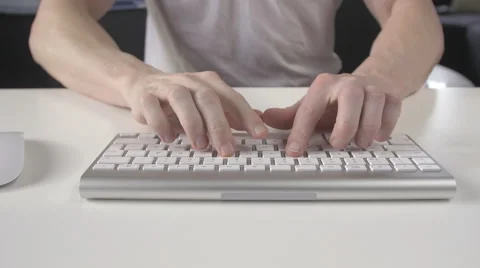 Man is typing on the keyboard and use the mouse Stock Footage 62723980