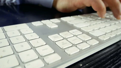 A man is typing on a keyboard. Close-up. Video stock 130312892