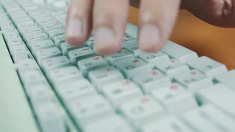 A man is typing on the keyboard Stock Footage 70169207