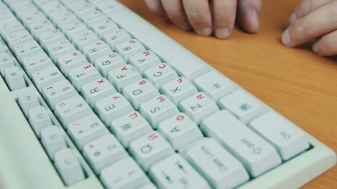 A man is typing on the keyboard Stock Footage 70169277