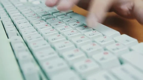 A man is typing on the keyboard Stock Footage 70169427