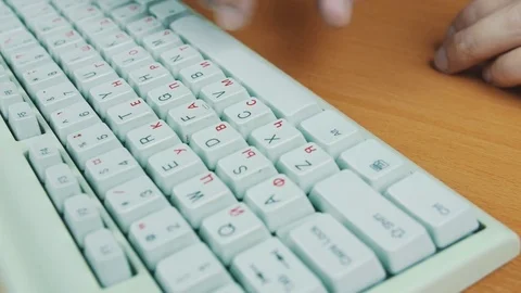 A man is typing on the keyboard Stock Footage 70169434