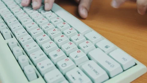 A man is typing on the keyboard Stock Footage 70169435