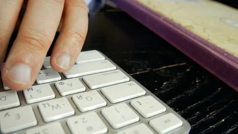 A man is typing on a keyboard. Stock-Footage 130311458