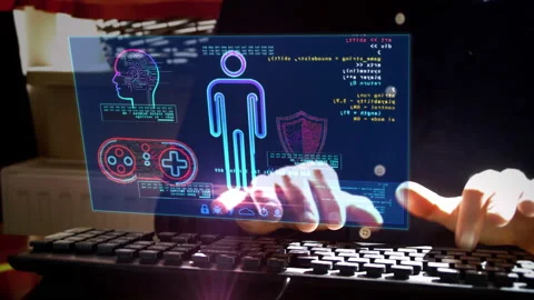Man typing on keyboard with game creating on hologram screen Stock Footage 129673356