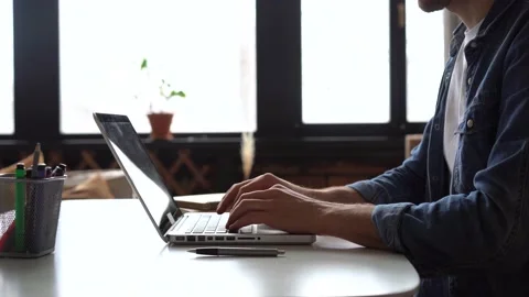 Man typing on keyboard of laptop. Side view. Stock Footage 147437495