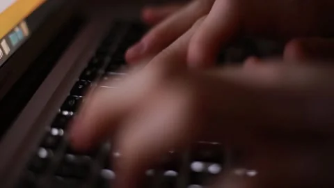 Man typing on keyboard at night 動画素材 143727907