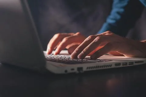 Man typing on a keyboard Stock Photos