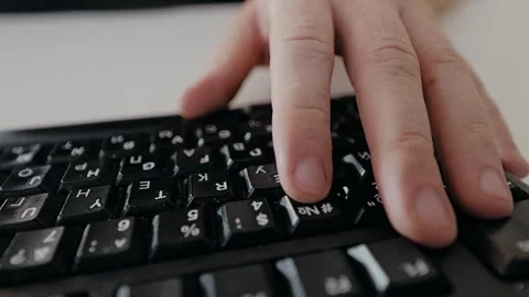 Man Typing on Keyboard Represents Digital War and Hidden Cybersecurity Battles Stock Footage 319542861