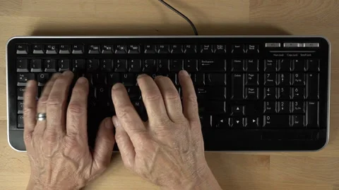 A man typing on a keyboard in sped-up motion Stock Footage 209954436