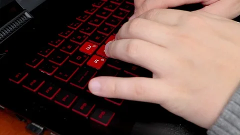Man typing on a keyboard with two hands Stock Footage 99108271