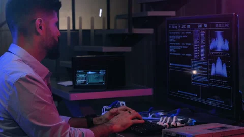 Man Typing on Keyboard while Programming on Advanced Interface. Hacker. Stock Footage 155902071