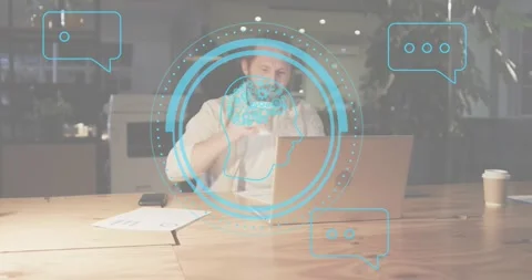 Man typing on laptop activating chat icons pausing sipping coffee checking phone Stock Footage 318173403