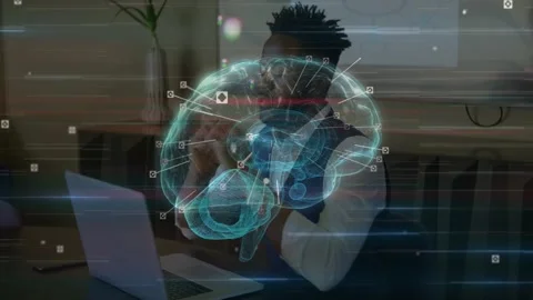 Man typing on laptop activating rotating holographic brain overlay with markers Video stock 329551154
