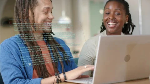 Man typing on laptop after glancing, woman leaning in pointing, code overlay Stock Footage 334703310