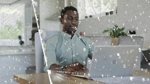 Man typing laptop analyzing finance data, starting numeric overlays, partner Stock Footage 335235309