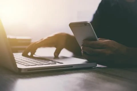 Man typing laptop and using smartphone for online shopping and pay by credit Stock Photos