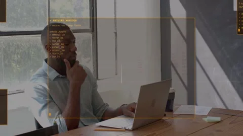 Man typing on laptop causing HUD overlay framing head, pausing, analyzing Stock Footage 333210814