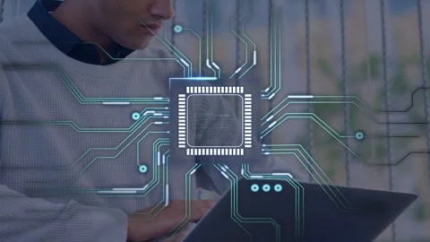 Man typing on laptop causing tech chip overlay growing across laptop to show Stock Footage 335652107