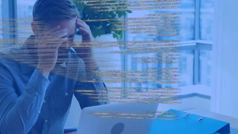 Man typing on laptop as code overlay intensifying, obscuring hands, pausing, Stock Footage 334729137