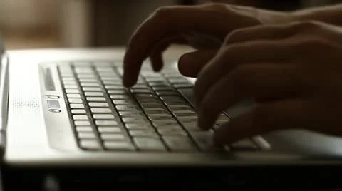 Man typing on laptop computer Stock Footage 11130833