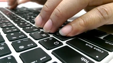 Man typing on laptop computer Stock Footage