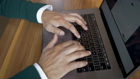 Man typing on laptop computer Stock Footage 234081863