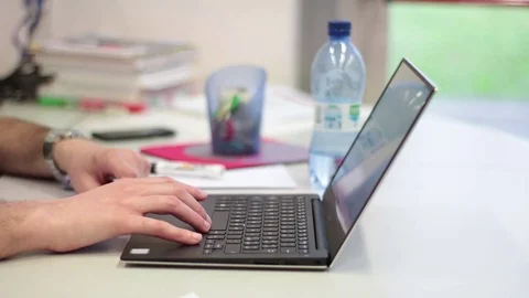 Man typing laptop computer in office Stock Footage
