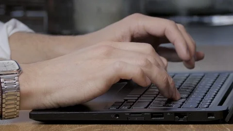 Man Typing on Laptop Computer Working from Home or Corporate Business Stock Footage 99397657