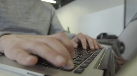Man typing on laptop computer.Man hands typing on a computer keyboard Stock Footage 64842455