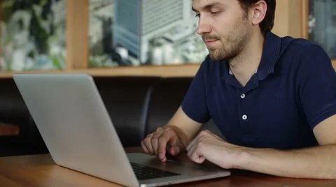 Man typing at a laptop Stock Footage 56564626