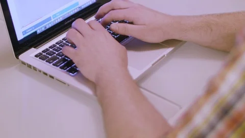 Man typing on the laptop Stock Footage 86094198