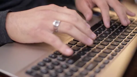 A man typing on a laptop Stock Footage 272285707