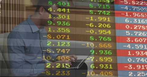 Man typing on laptop on gray sofa in office lounge, showing streaming stock 動画素材 308658203