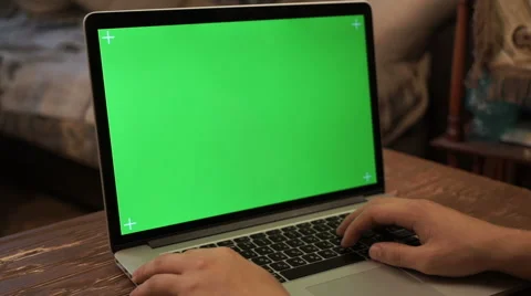 A man typing on a laptop. Green screen, Video stock 68644527