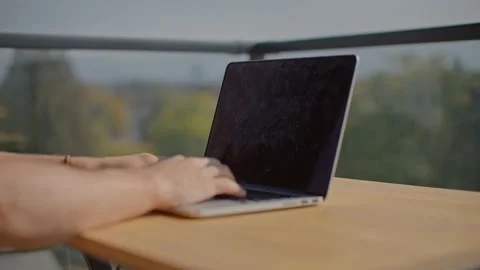 Man typing on laptop, green screen laptop mockup, outdoor office 库存影片 218466906