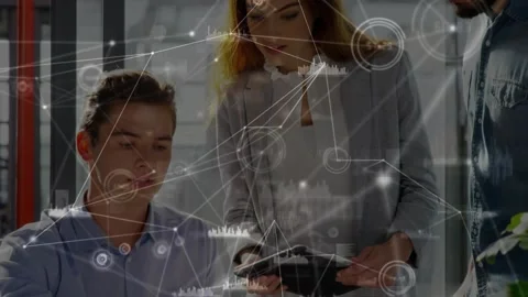 Man typing on laptop initiating tech data overlays as woman pointing tablet and Stock Footage 317185465