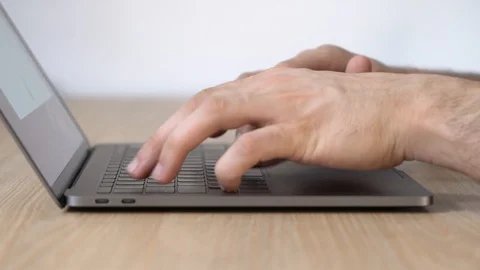 Man Typing On Laptop Keyboard, Close-up Stock Footage 128976937