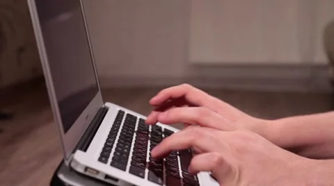 A man is typing on laptop keyboard Stock Footage 58395365