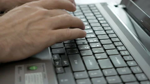 A man is typing on a laptop keyboard Stock Footage 65219860