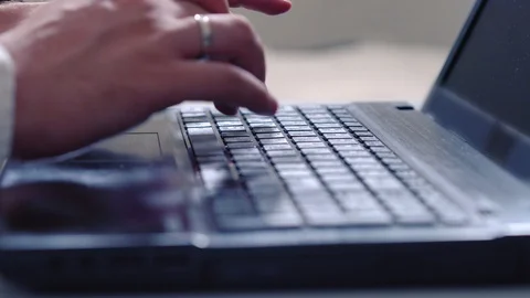 Man typing on a laptop keyboard Stock Footage 111293581