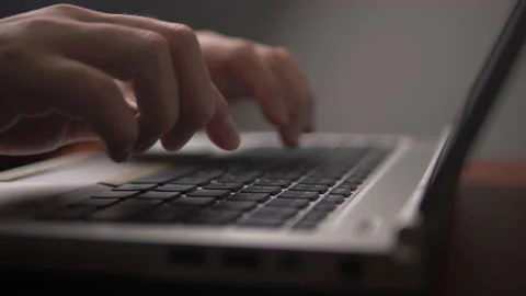 Man typing on laptop keyboard Video stock 134303988